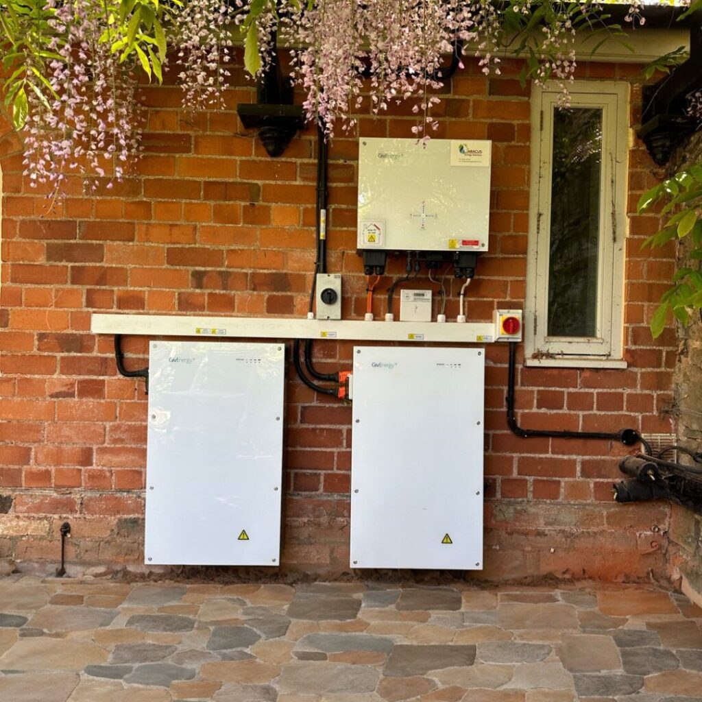 Two home batteries fitted on an outside wall after adding a battery to existing solar panels