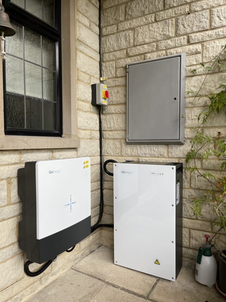 Floor-standing home battery fitted beside a window